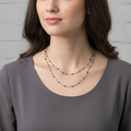 Model wearing  the Long Twisted Metal Chain with Black Beads - Elegant Statement Necklace