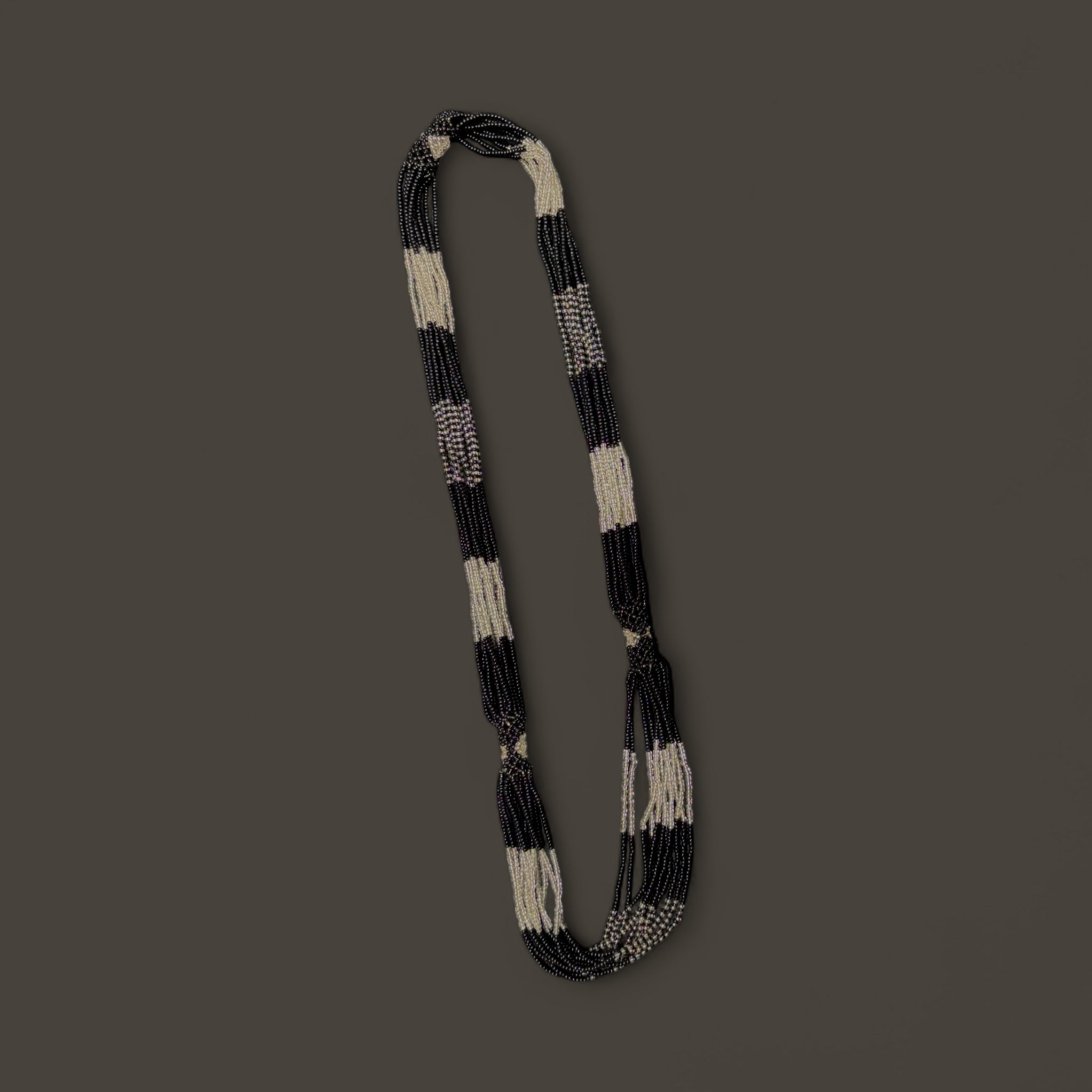 String of black and white beaded necklace