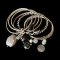 Stack of Silver Bangles with Unique Design and Stones